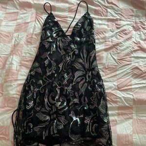 Lucy in the sky dress, very shiny and sexy for any formal event. Never worn.